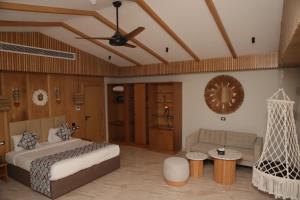 a bedroom with a bed and a hammock in it at Panorama Bungalows Resort El Gouna in Hurghada