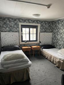 Postel nebo postele na pokoji v ubytování Villa Lyckan