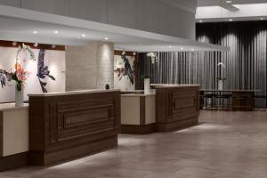 a lobby with a hair salon with a reception counter at Renaissance Chicago North Shore Hotel in Northbrook