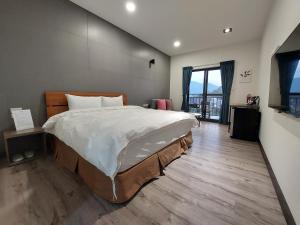 En eller flere senger på et rom på 清境依山舞林民宿