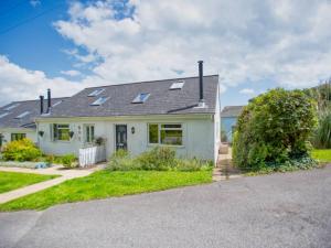 a white house with a gray roof at Fernhill Cottage, Jurassic Coast in Charmouth