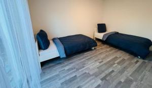 Postel nebo postele na pokoji v ubytování Apartment Weikersheim I