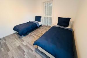 Postel nebo postele na pokoji v ubytování Apartment Weikersheim I