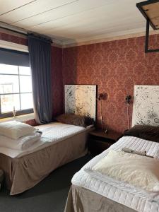 Postel nebo postele na pokoji v ubytování Villa Lyckan