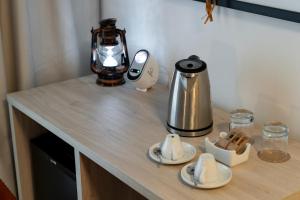 a counter with a coffee maker and a kettle on it at Hotel Magic Fantasy in Oropesa del Mar