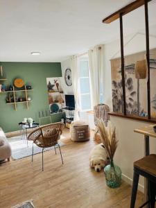 a living room with a dog laying on the floor at Le Cottage Breton, hypercentre historique StB in Saint-Brieuc