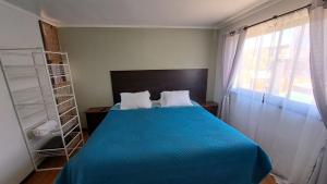 Postel nebo postele na pokoji v ubytování Yemanya Hostal