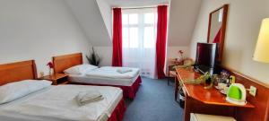 Ένα ή περισσότερα κρεβάτια σε δωμάτιο στο Hotel Magnolia