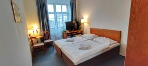 Ένα ή περισσότερα κρεβάτια σε δωμάτιο στο Hotel Magnolia