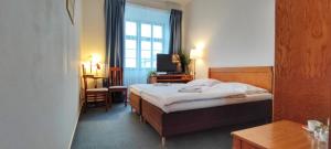 Ένα ή περισσότερα κρεβάτια σε δωμάτιο στο Hotel Magnolia