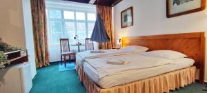 Ένα ή περισσότερα κρεβάτια σε δωμάτιο στο Hotel Magnolia