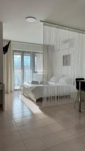 a bedroom with a large bed with glass walls at Casa Valentina 3 in Perugia