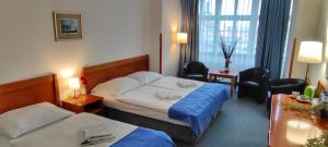 Ένα ή περισσότερα κρεβάτια σε δωμάτιο στο Hotel Magnolia