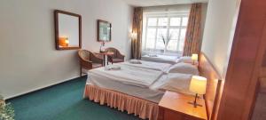 Ένα ή περισσότερα κρεβάτια σε δωμάτιο στο Hotel Magnolia