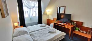 Ένα ή περισσότερα κρεβάτια σε δωμάτιο στο Hotel Magnolia