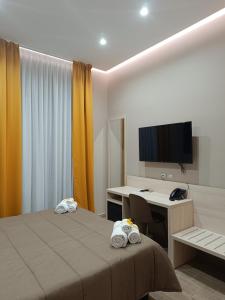 TV a/nebo společenská místnost v ubytování Schilizzi Hotel