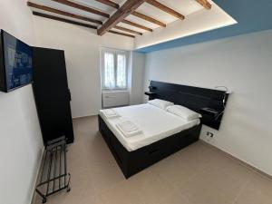 Ένα ή περισσότερα κρεβάτια σε δωμάτιο στο La Casa di Nonno Bino