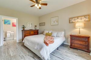 a bedroom with a bed and a ceiling fan at Country Home Near Fredericksburg Fire Pit and Grill in Tivydale