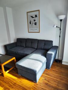 a living room with a couch and a coffee table at Apartamento Pena Furada in Ribadeo