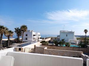 a view from the roof of a house with palm trees at CASA AL MARE LUXURY in Bari