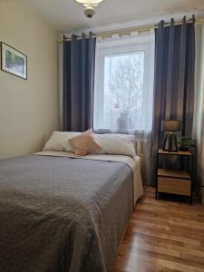 Posteľ alebo postele v izbe v ubytovaní Apartament na Błoniach