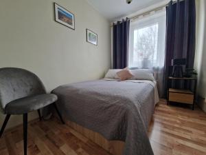Posteľ alebo postele v izbe v ubytovaní Apartament na Błoniach