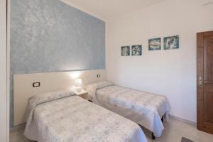 Postel nebo postele na pokoji v ubytování Casa Teo, Vista Mozzafiato a Lacona!
