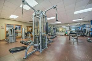 a gym with treadmills and weights and machines at Alpine Getaway with Grill Walk to Lake! in Sapphire