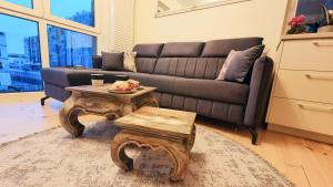 a living room with a couch and a coffee table at NOWY Apartament Pełen Życia in Białystok +29 photos