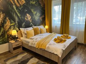 Posteľ alebo postele v izbe v ubytovaní Silver Apartman