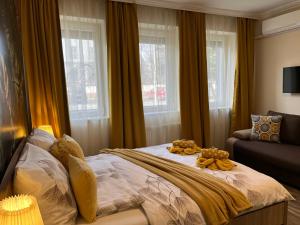 Posteľ alebo postele v izbe v ubytovaní Silver Apartman