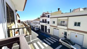 a view from a balcony of a street with buildings at Suit Dreams Vilaflor By Deihu Experiences in Vilaflor