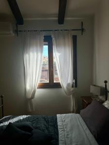Cama o camas de una habitación en Prezioso appartamento con vista mozzafiato - Casa Enrica
