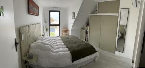 a bedroom with a large bed in a room at Villa front de mer Carnac in Carnac