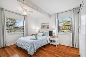 A bed or beds in a room at Hernando Hideaway:Heated Pool/Decks/Dock/Balcony/Yard w/ Firepit/Kayaks