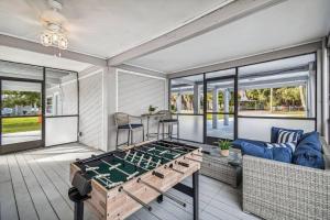A seating area at Hernando Hideaway:Heated Pool/Decks/Dock/Balcony/Yard w/ Firepit/Kayaks