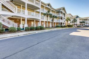 a street in front of a large apartment building at Relax at Barefoot Getaway in North Myrtle Beach! in North Myrtle Beach