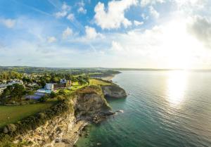 an aerial view of the shore of a body of water at The Carlyon Bay Hotel and Spa in St Austell