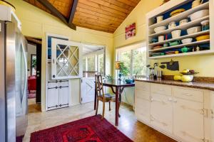 a kitchen with a table and a dining room at Lakefront Glen Ellen Cabin with Views Near Wineries! in Glen Ellen +18 photos
