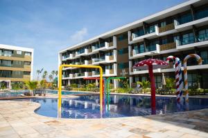 Swimmingpoolen hos eller tæt på FLAT TÉRREO - MANA BEACH EXPERIENCE - PRAIA DE MURO ALTO + 18 billeder