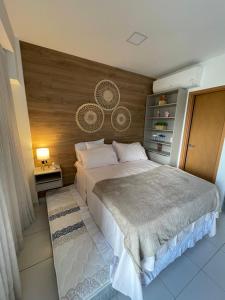 En eller flere senge i et værelse på FLAT TÉRREO - MANA BEACH EXPERIENCE - PRAIA DE MURO ALTO