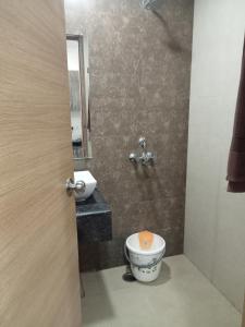 a bathroom with a toilet and a sink at Namoh hotels in Ghaziabad