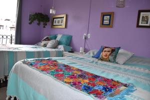 En eller flere senge i et værelse på Antigua ITZAE San Miguel de Allende dog friendly
