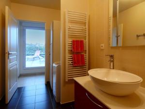 a bathroom with a sink and a view of a patio at Appartement spacieux avec rooftop et garages privés à 3 min de la gare d'Épernon - FR-1-581-129 in Épernon +24 photos