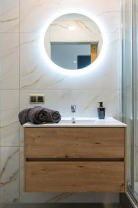 a bathroom with a sink and a mirror at Cozy Room, Just Renovated in Tilburg