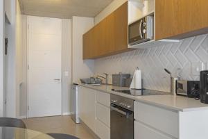 a kitchen with a sink and a counter top at 105 On KOI by Host Agents in Ballito