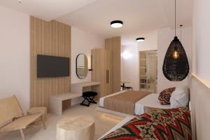 a hotel room with a bed and a tv at Likio Studios in Batsi