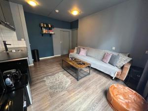 a living room with a couch and a coffee table at 7B&B in Amsterdam