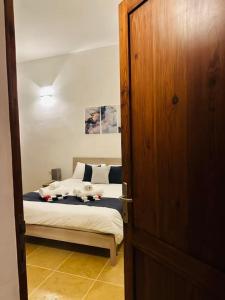 Postel nebo postele na pokoji v ubytování Dawlet ix-Xemx Gozo Farmhouse