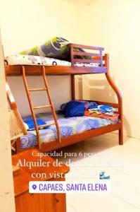 two bunk beds in the corner of a room at Departamento Mar de Cristal in Santa Elena